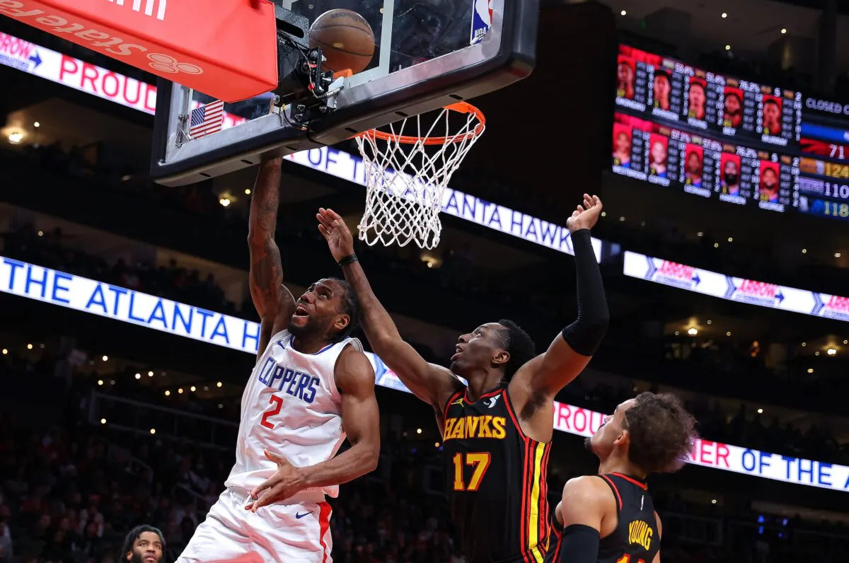 Kawhi Leonard (2) of the LA Clippers attacks the basket against Onyeka Okongwu (17) and Trae Young (11) of the Atlanta Hawks during the fourth quarter in Atlanta on Feb. 5, 2024. (Kevin C. Cox/Getty Images)