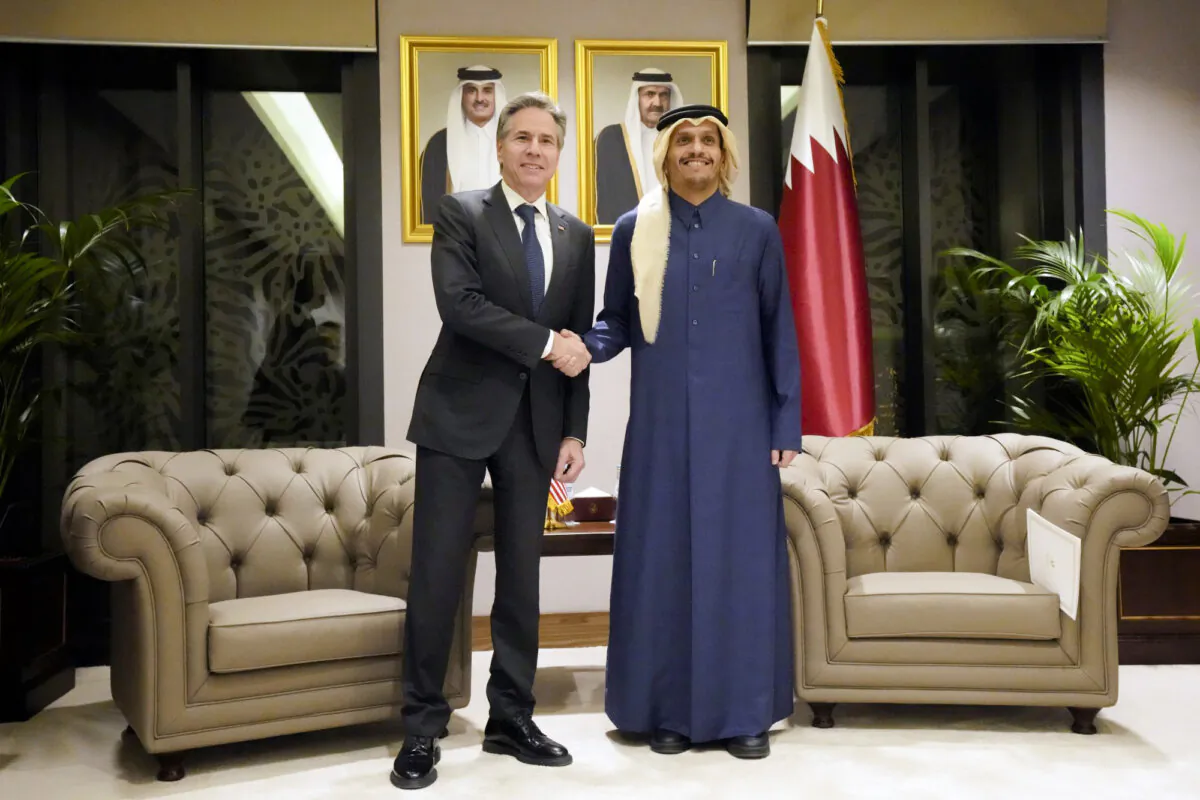 Secretary of State Antony Blinken, (L), shakes hands with Qatar's Prime Minister and Foreign Affairs Minister Mohammed Bin Abdulrahman Al Thani, at Diwan Annex, in Doha, Qatar, on Feb. 6, 2024. (Mark Schiefelbein/AP Photo)