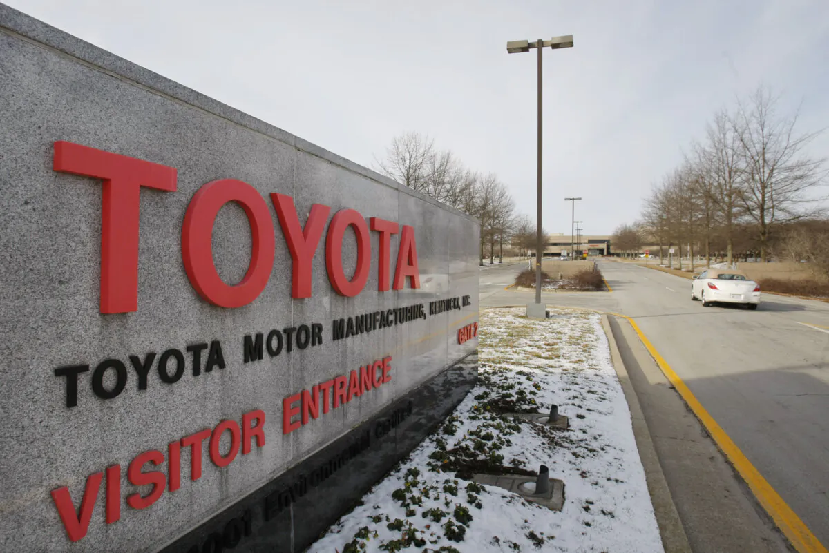 A car drives past the entrance to the Toyota Motor Manufacturing plant in Georgetown, Ky., on Jan. 27, 2010. (Ed Reinke/AP Photo)