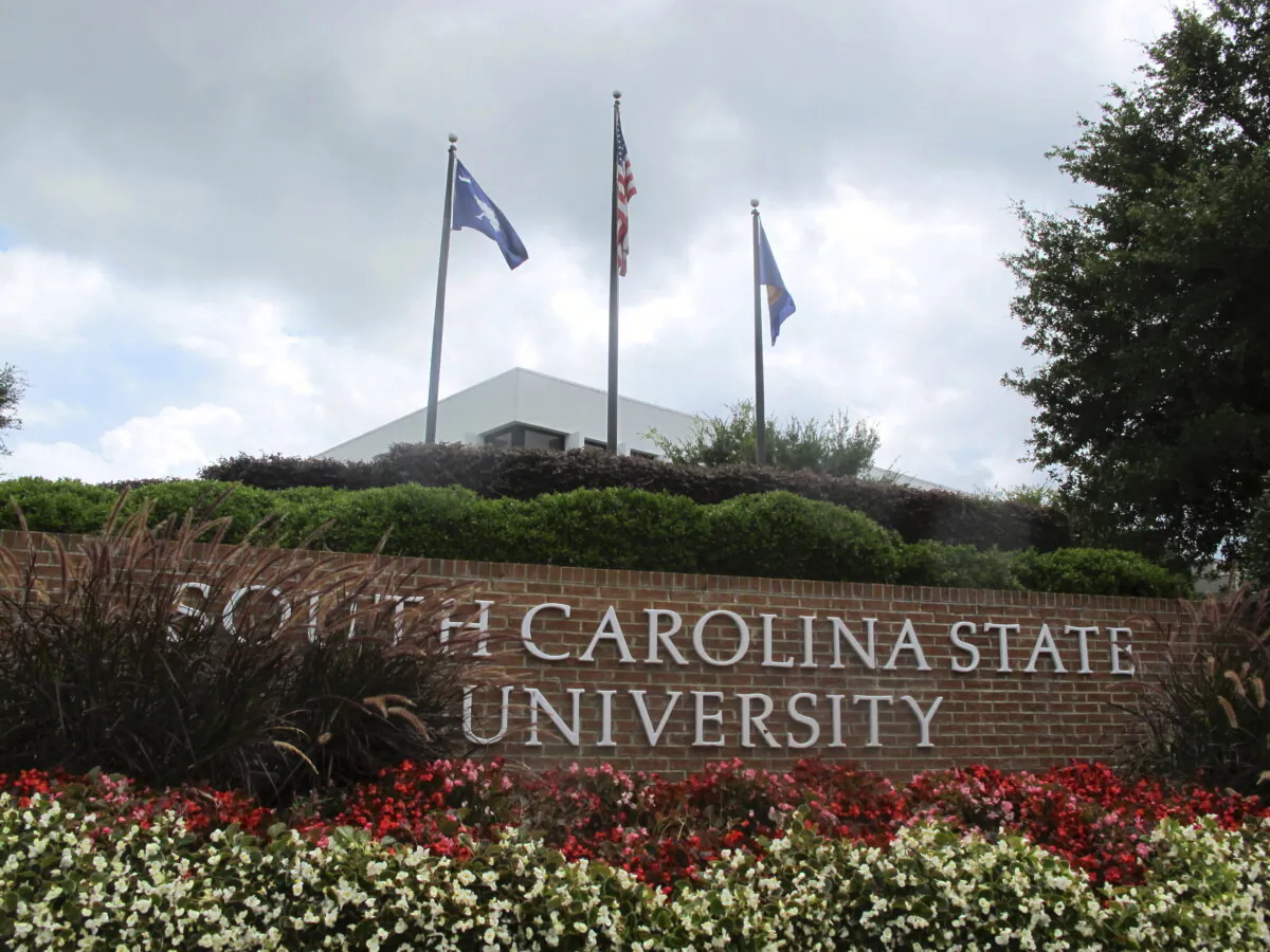 Flags fly at the entrance to South Carolina State University in Orangeburg, S.C., on July 22, 2014. (Bruce Smith/AP Photo)