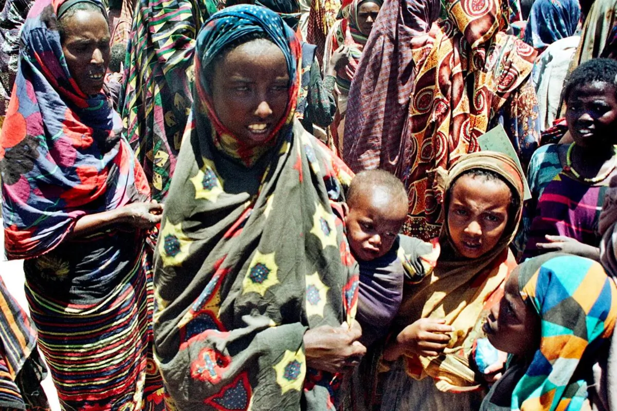 Somali mothers and children waiting for food from UNICEF feeding center in Wajid, a town in southern Somalia, April 13, 2000. Somalia has one of the highest infant and child mortality rates in the world for many diseases, including measles. (Ali Musa/AFP/Getty Images)