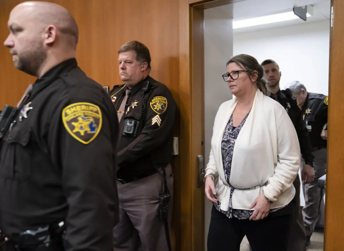 Jennifer Crumbley walks into the Oakland County courtroom of Judge Cheryl Matthews in Pontiac, Mich., on Feb. 6, 2024. (Mandi Wright/Detroit Free Press via AP, Pool)