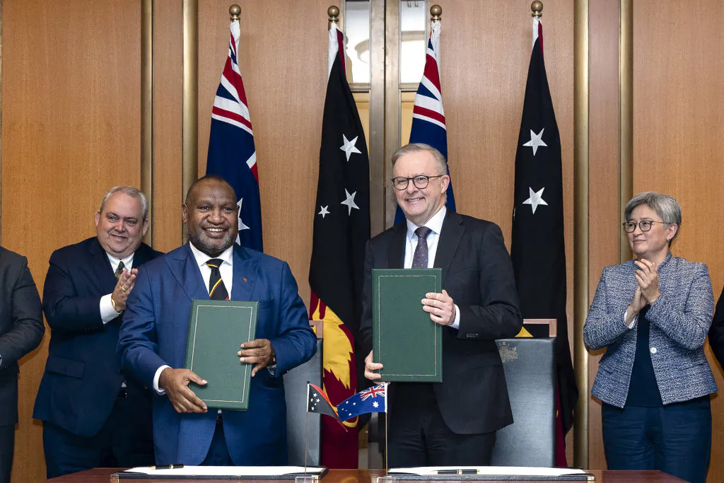 Australia's Prime Minister Anthony Albanese (2nd R) participates in an official signing ceremony with Papua New Guinea's Prime Minister James Marape (2nd L) at Parliament House in Canberra on December 7, 2023. (Hilary Wardhaugh/AFP via Getty Images)