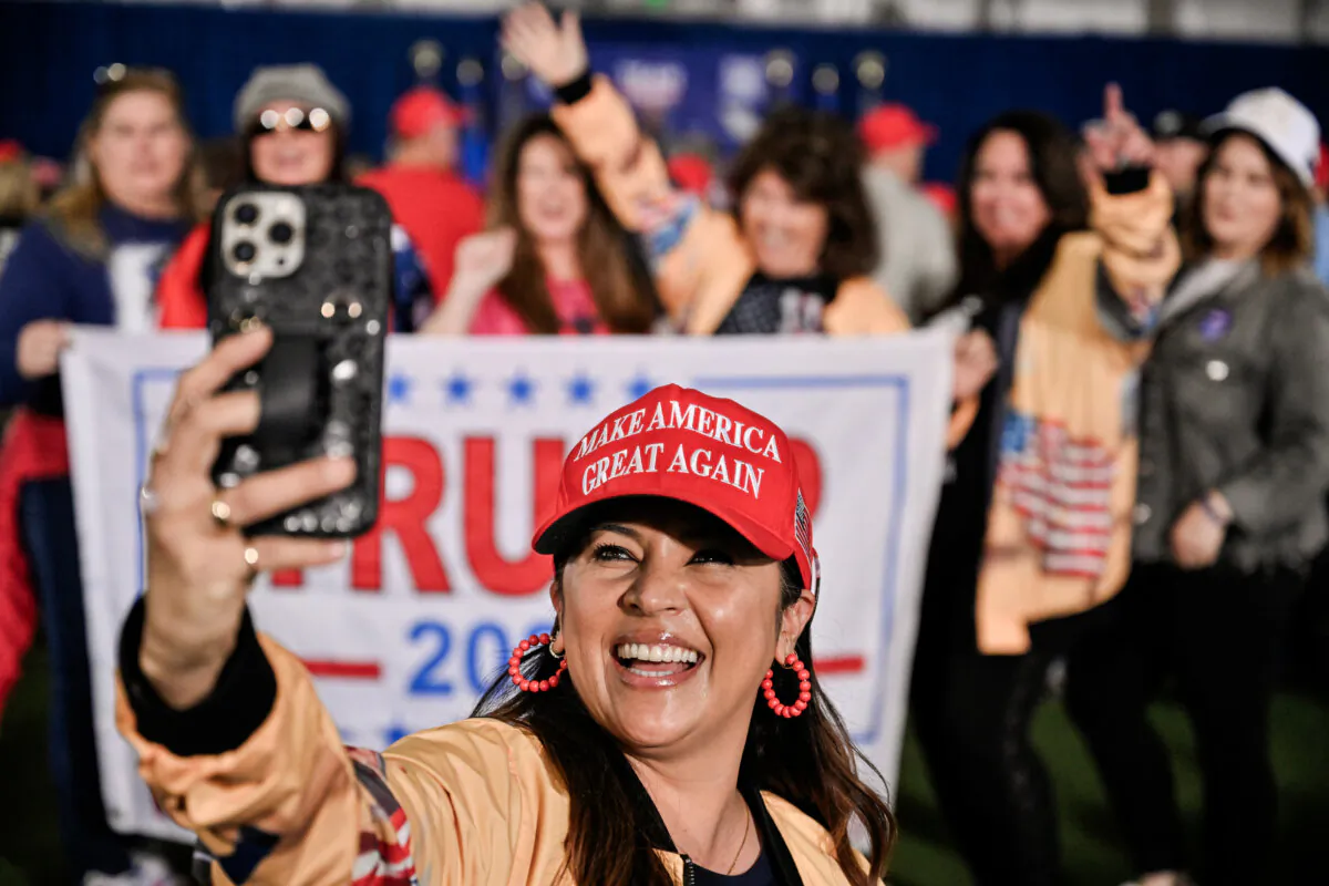 A woman takes a selfie before a campaign event for former President Donald Trump in Las Vegas on Jan. 27, 2024. (David Becker/Getty Images)