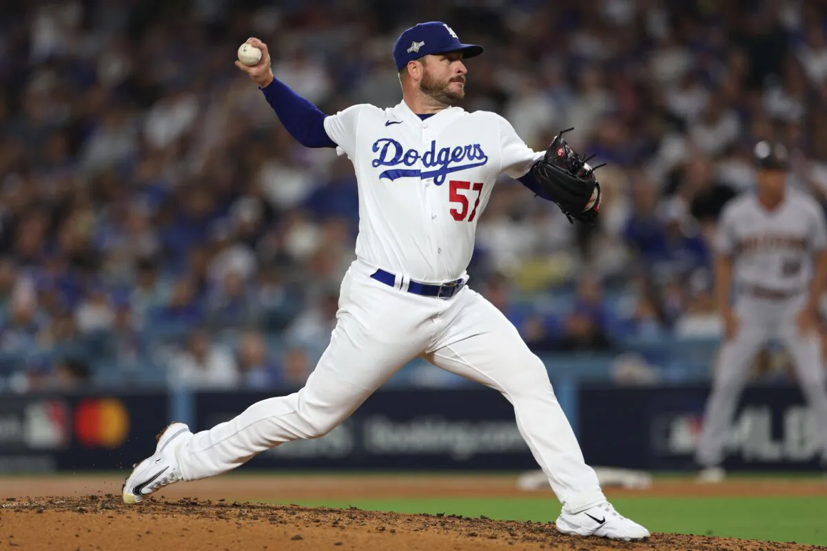 Ryan Brasier (57) of the Los Angeles Dodgers pitches against the Arizona Diamondbacks during the fifth inning in Game Two of the Division Series in Los Angeles on Oct. 9, 2023. (Harry How/Getty Images)