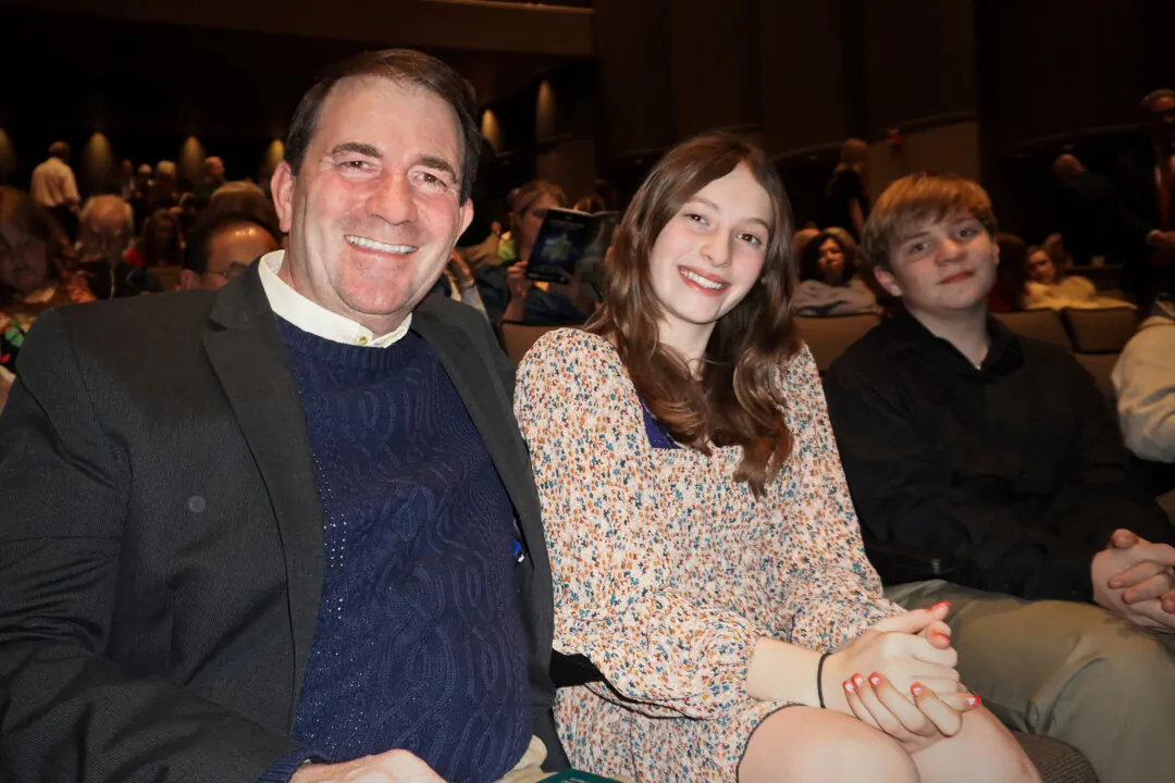 Jeff Kennedy and his children enjoyed Shen Yun's evening performance at the Von Braun Center Concert Hall on Feb. 6, 2024. (Sally Sun/The Epoch Times) 