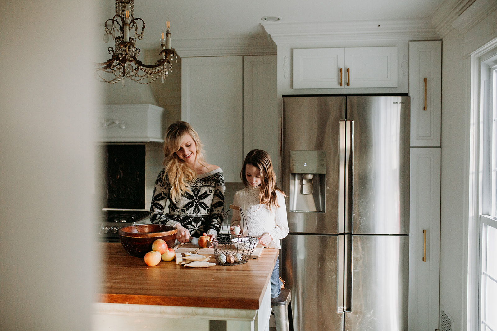 Holly learning to bake from her mother.