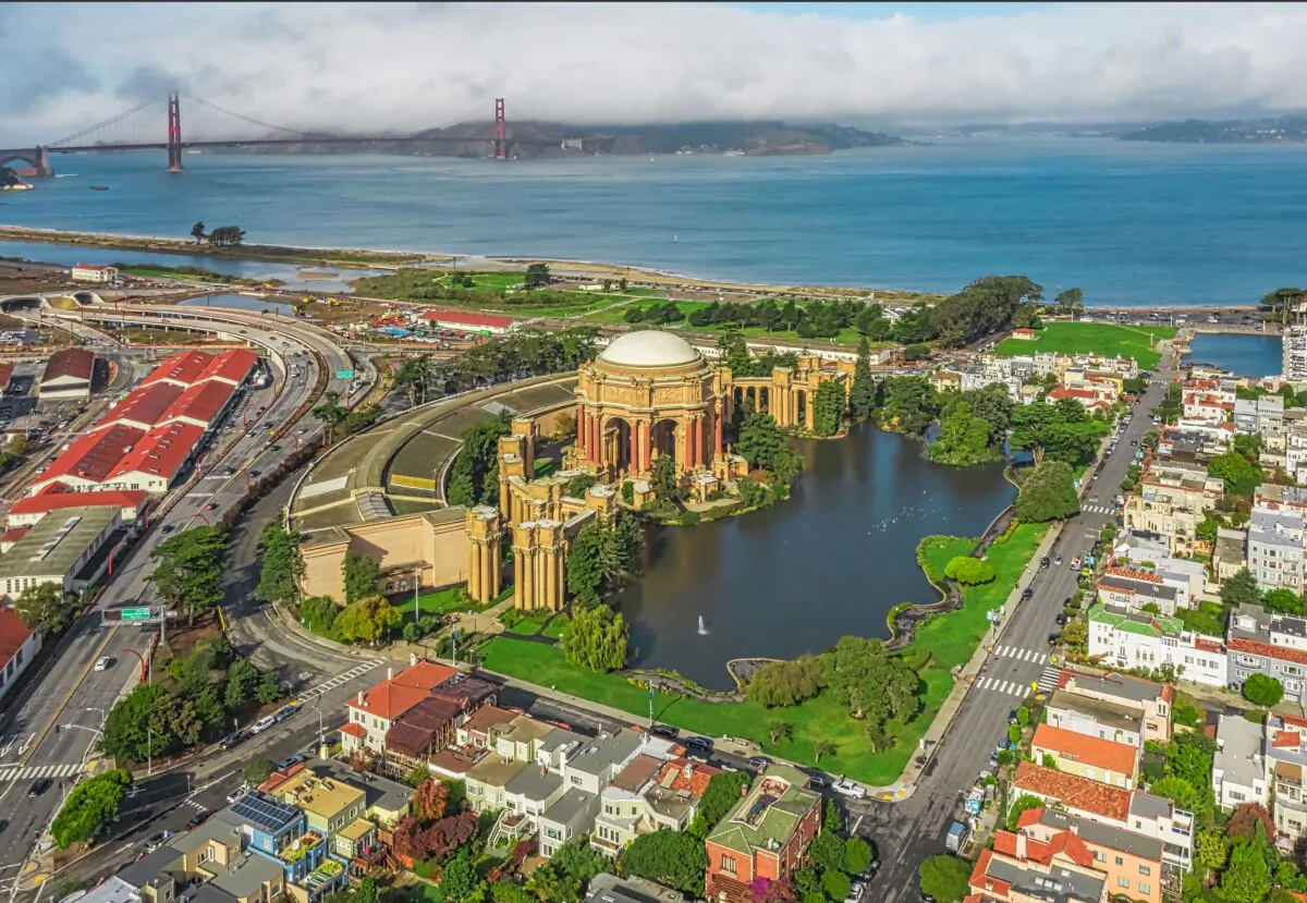 In an aerial view of the Palace of Fine Arts shows grounds of almost 17 acres that border an artificial lagoon. The Palace Park is near the Presidio, once an army base in San Francisco. The area surrounding the Palace is now called the Marina District in San Francisco. (Lebid Volodymyr/Shutterstock)