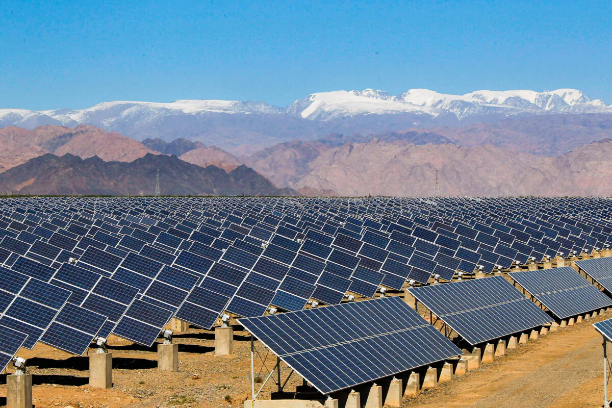 Large solar panels are seen in a solar power plant in Hami, northwest Xinjiang region, China, on May 8, 2013. (STR/AFP via Getty Images)