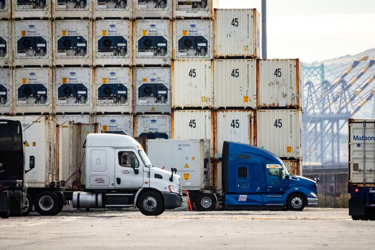 Truckers transport cargo in the Port of Long Beach, Calif., on Nov. 29, 2023. (John Fredricks/The Epoch Times)