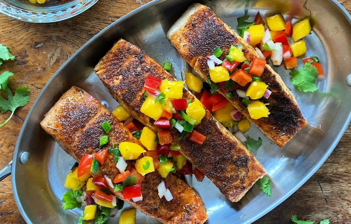 A juicy mango salsa cools and complements this savory, spicy salmon. (Lynda Balslev for Tastefood)