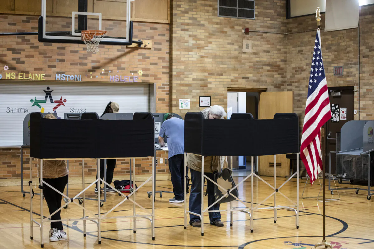 People vote on election day on Nov. 8, 2022, in Grand Rapids, Mich. After months of candidates campaigning, Americans are voting in the midterm elections to decide close races across the nation. (Photo by Bill Pugliano/Getty Images)