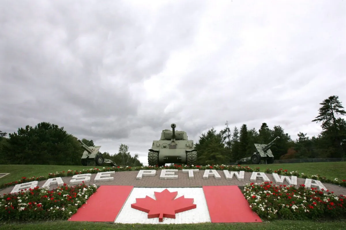 Clouds loom over the main gate at Canadian Forces Base Petawawa, Ont., on Sept. 4, 2006. (The Canadian Press/Jonathan Hayward)