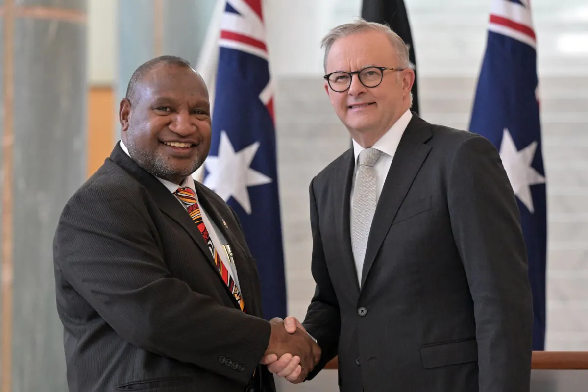 Australia’s Prime Minister Anthony Albanese and Papua New Guinea’s Prime Minister James Marape after signing the visitors book at Parliament House in Canberra, Australia on Feb. 8, 2024. (AAP Image/Mick Tsikas)