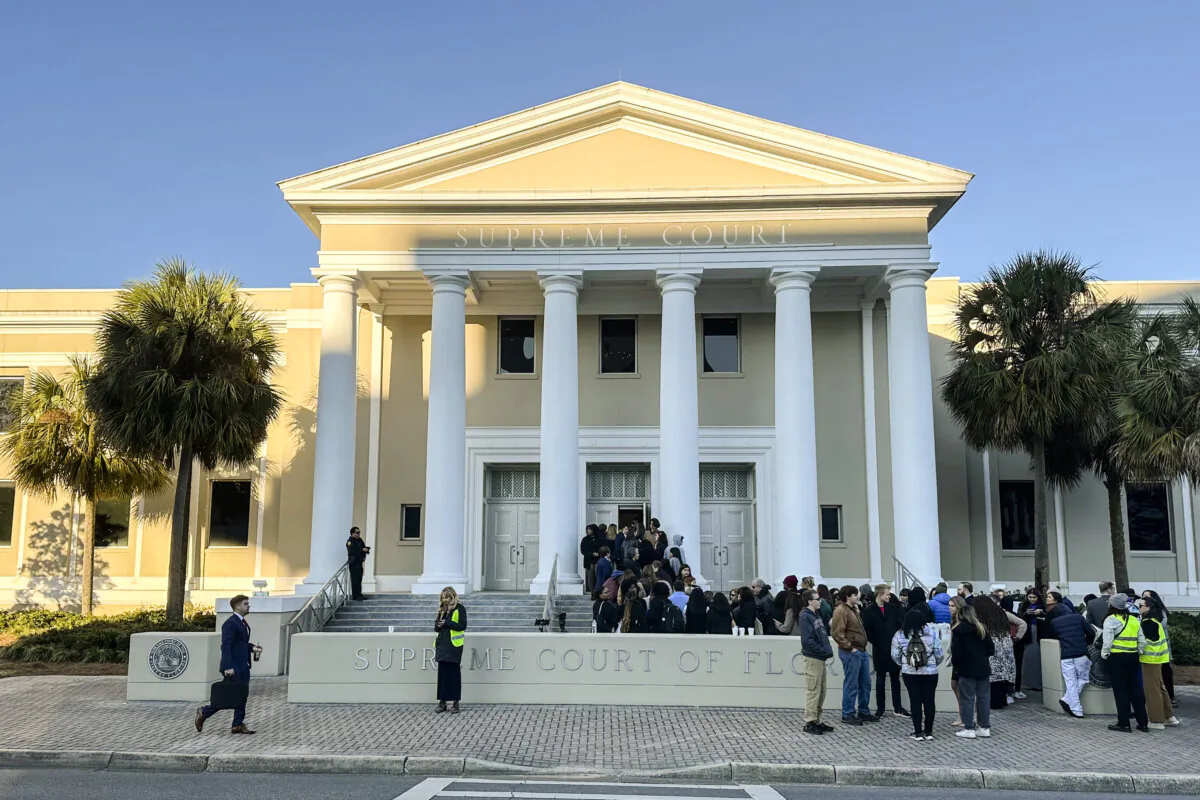 People gather outside the Florida Supreme Court, where justices will hear arguments on a proposed ballot issue regarding abortion, in Tallahassee, Fla., on Feb. 7, 2024. (Brendan Farrington/AP Photo)