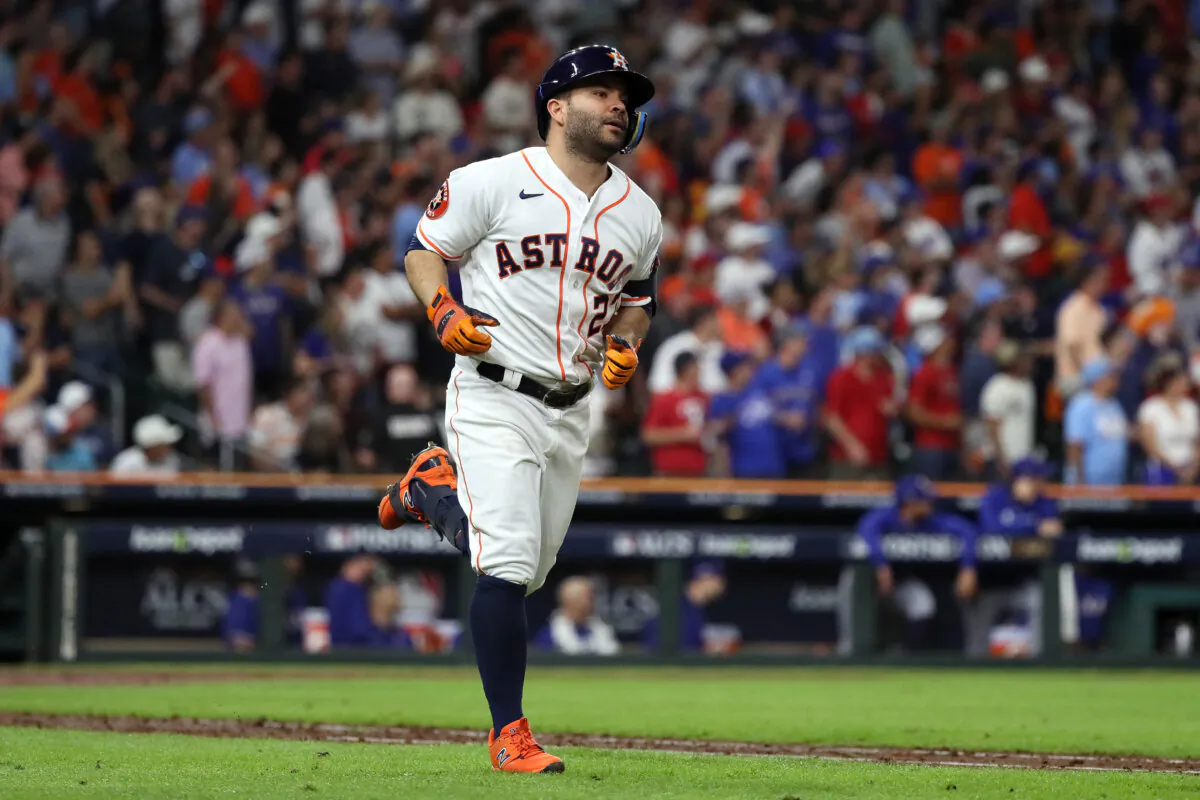 Jose Altuve #27 of the Houston Astros rounds the bases after hitting a solo home run against Jose Leclerc #25 of the Texas Rangers during the ninth inning in Game Seven of the American League Championship Series at Minute Maid Park in Houston, Texas, on Oct. 23, 2023. (Bob Levey/Getty Images)