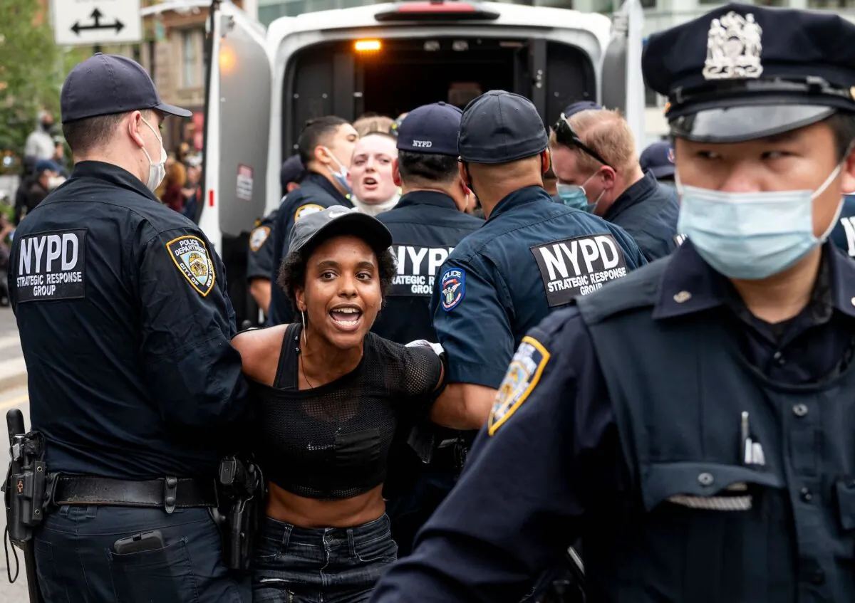 NYPD officers arrest a protestor during a Black Lives Matter demonstration in New York City on May 28, 2020. (Johannes Eisele/AFP via Getty Images)