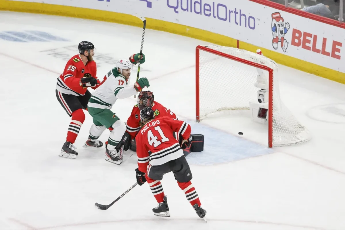 Minnesota Wild left wing Marcus Foligno (17) celebrates after scoring against Chicago Blackhawks goaltender Petr Mrazek (34) during the third period at United Center in Chicago on Feb. 7, 2024. (Kamil Krzaczynski/USA TODAY Sports via Field Level Media)
