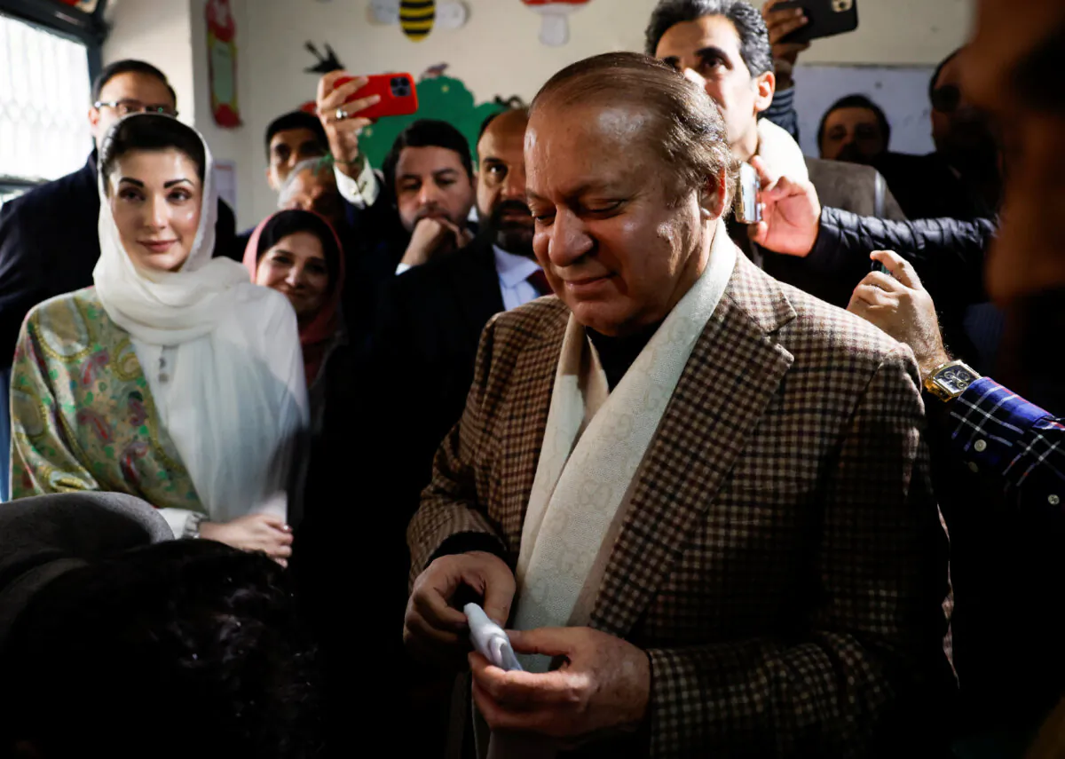 Former prime minister Nawaz Sharif smiles as he casts his vote at a polling station during the general election in Lahore, Pakistan, on Feb. 8, 2024. (Navesh Chitrakar/Reuters)