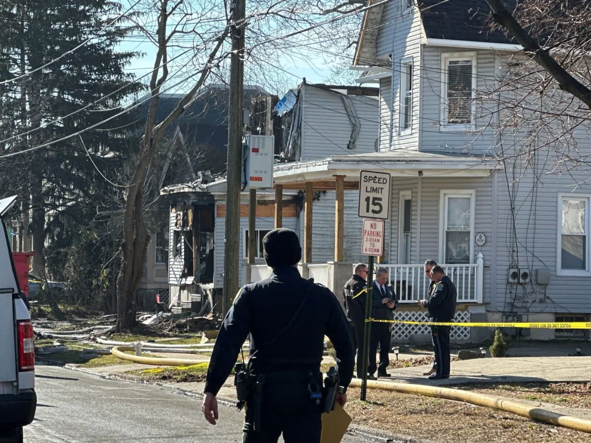 Emergency personnel work at the scene where two police officers were injured while responding to reported standoff in East Lansdowne, Pa., on Feb. 8, 2024. (Tassanee Vejpongs/AP Photo)