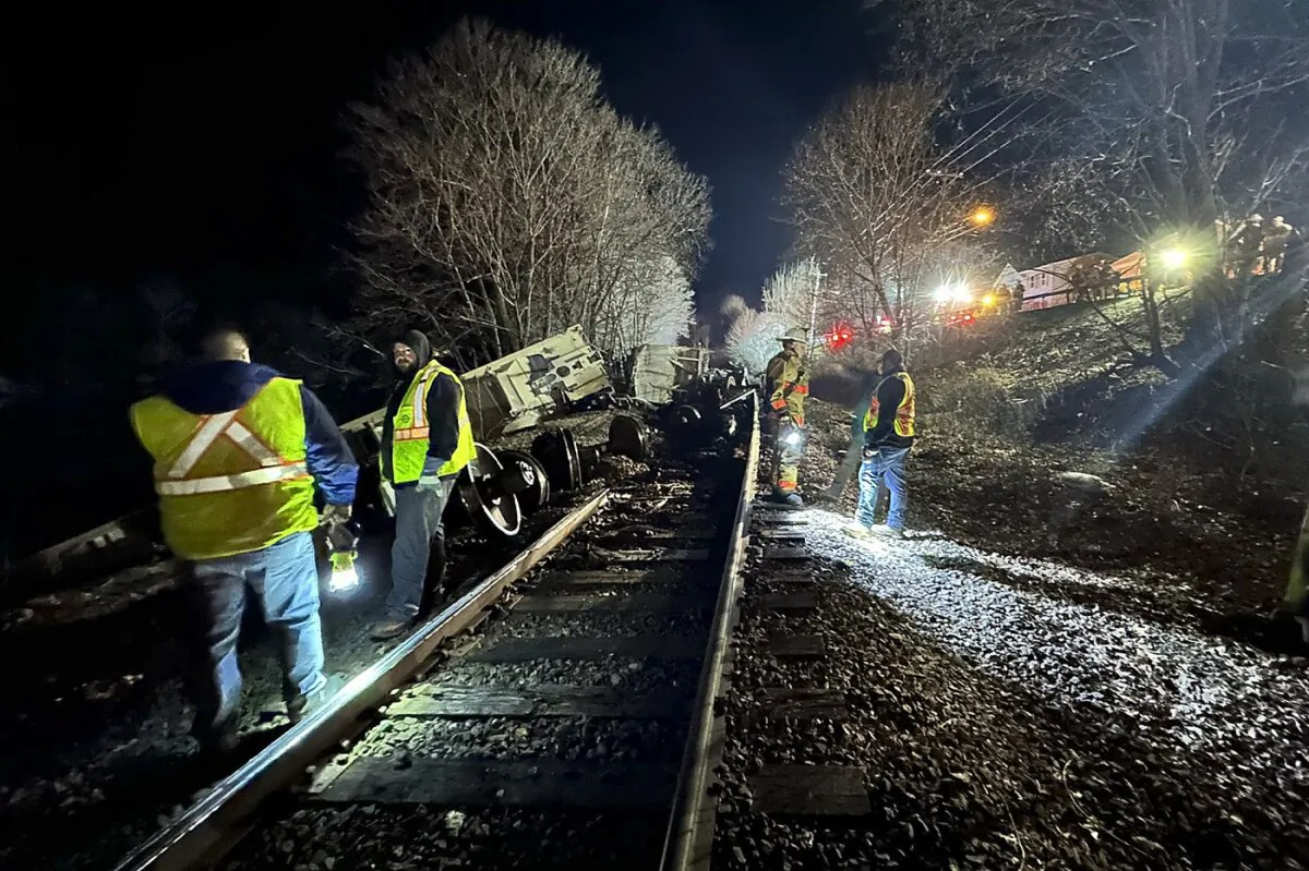 Train crews and first responders walk the site of a train derailment in Valley Falls, N.Y., on Feb. 7, 2024. (Basil Seggos/New York State Department of Environmental Conservation via AP)