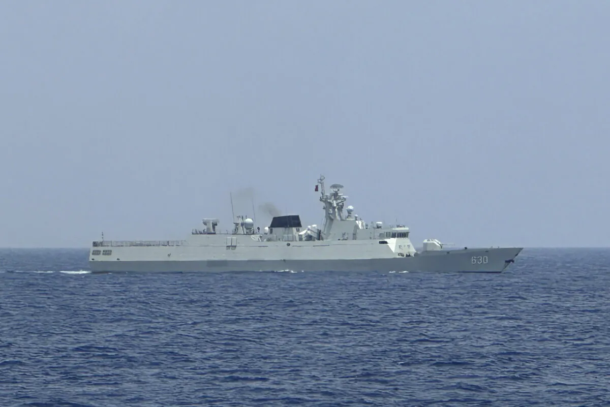 A Chinese Navy warship is seen in the contested waters in the South China sea on Oct. 4, 2023. (AP Photo/Joeal Calupitan)