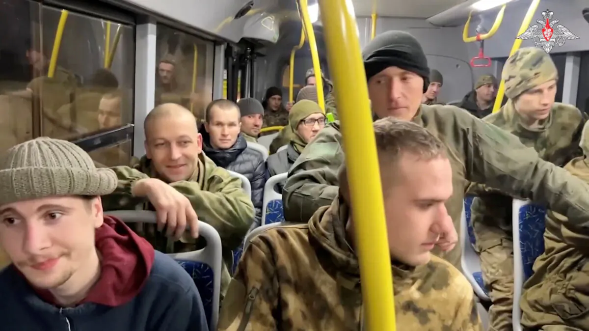 A still image from video shows captured Russian service personnel in a bus following the latest exchange of prisoners of war at an unknown location in the course of Russia-Ukraine conflict, in this image taken from handout footage released on Feb. 8, 2024. (Russian Defence Ministry/Handout via Reuters)