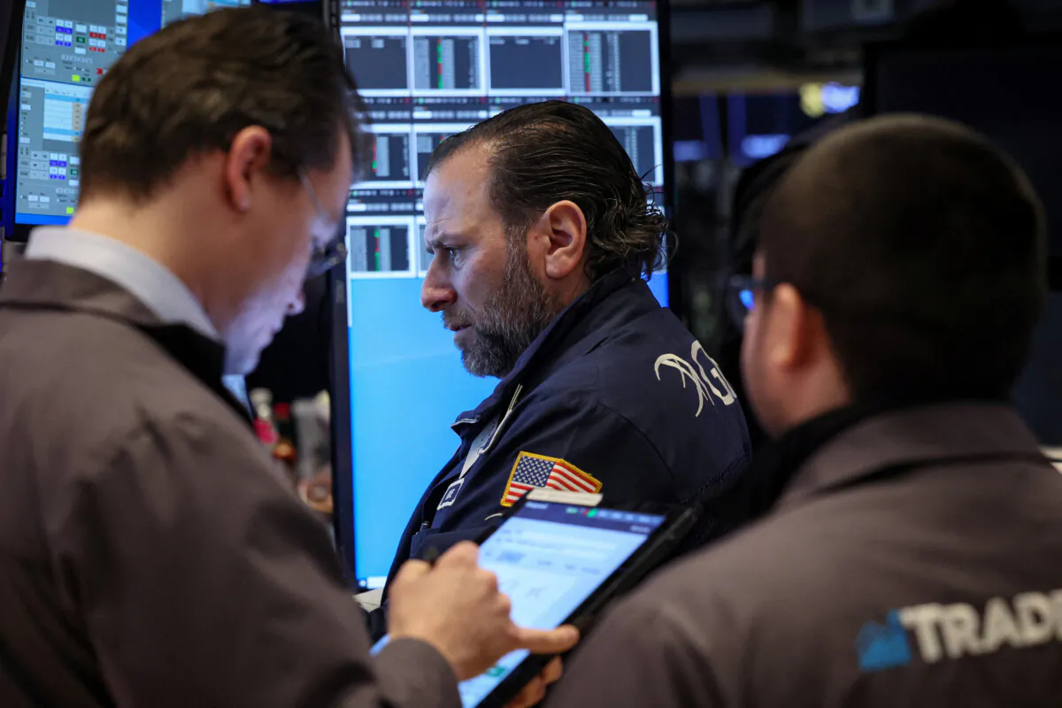 Traders work on the floor at the New York Stock Exchange (NYSE) in New York City on Feb. 7, 2024. (Brendan McDermid/Reuters)