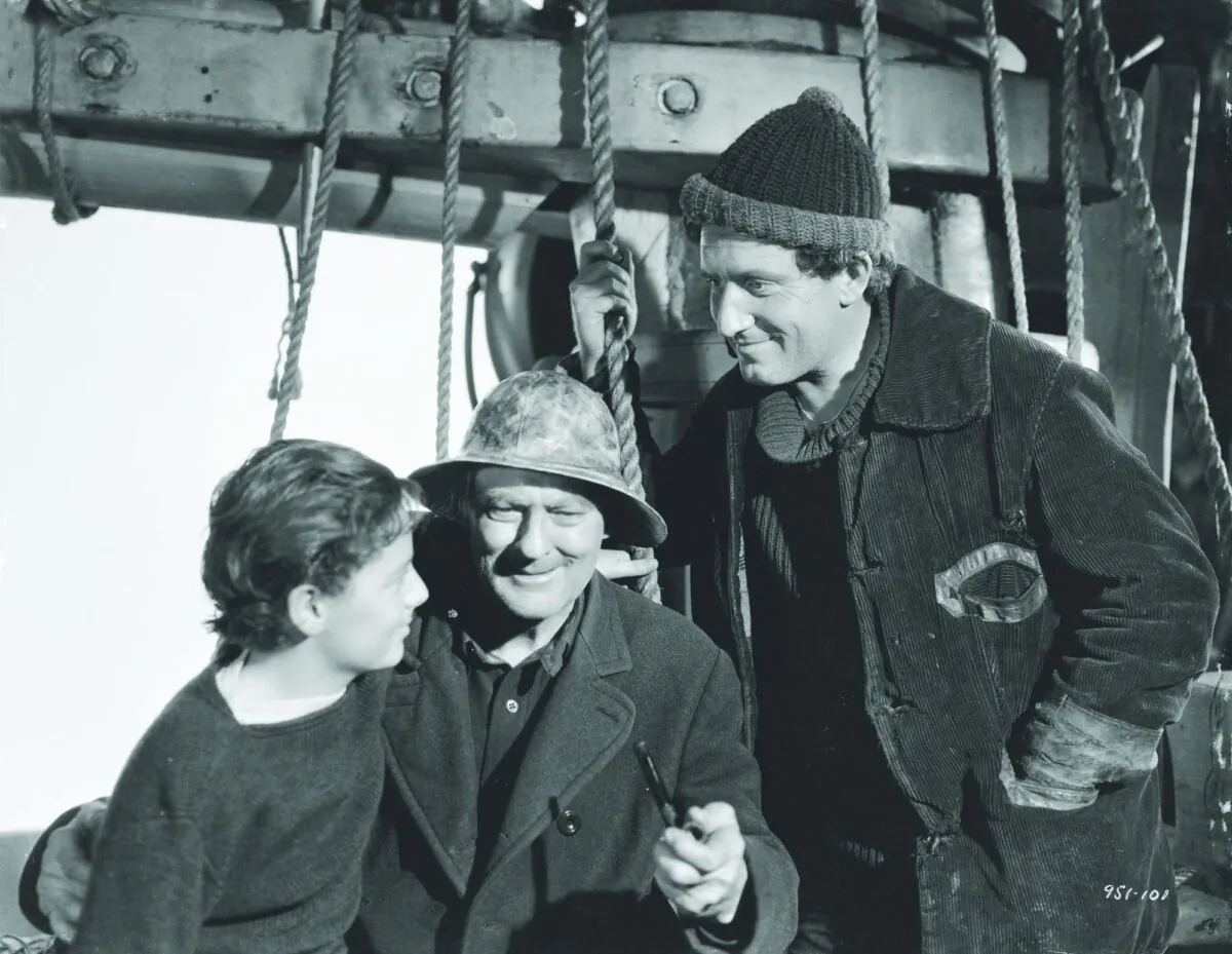 (L–R) Harvey Cheyne (Freddie Bartholomew), Capt. Disko Troop (Lionel Barrymore), and Manuel (Spencer Tracy), in “Captains Courageous.” (MGM)