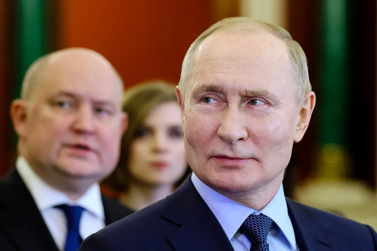Russian President Vladimir Putin visits an exhibition at the Kremlin in Moscow on Dec. 27, 2023. (Gavriil Grigorov/Sputnik/Kremlin Pool Photo via AP)