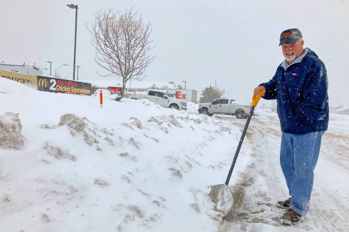 Dennis Fritsch, a trucker en route from Georgia to northern Nevada, stops at a truck stop in Bellemont, Ariz., on Feb. 8, 2024, after parts of Interstate 40 shut down because of the weather. (Felicia Fonseca/AP Photo)