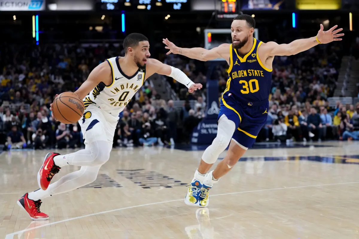 Tyrese Haliburton (0) of the Indiana Pacers drives against Stephen Curry (30) of the Golden State Warriors in the second quarter at Gainbridge Fieldhouse on Feb. 8, 2024. (Dylan Buell/Getty Images)