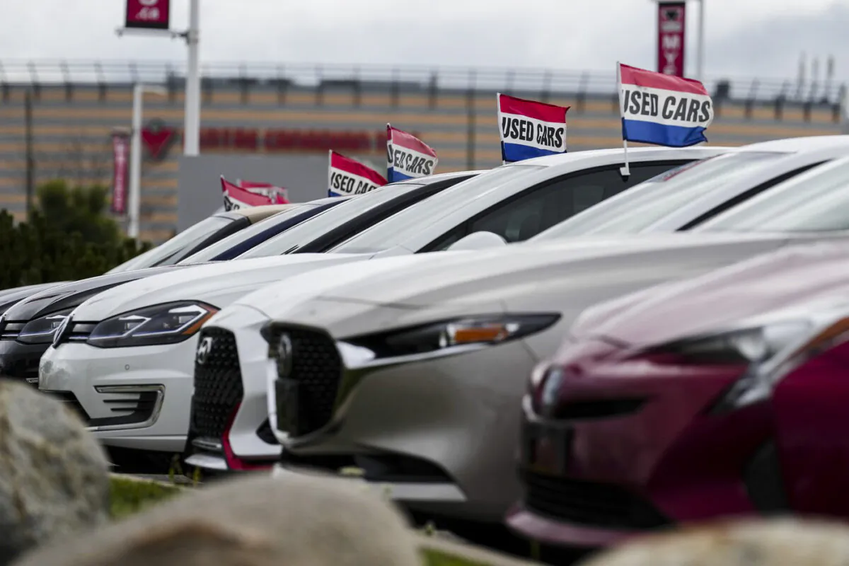 Used vehicles for sale are displayed at an automotive dealership in Ottawa on Aug. 11, 2023. (The Canadian Press/Sean Kilpatrick)