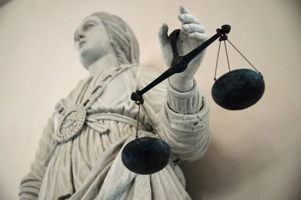 A picture taken on May 19, 2015 at Rennes' courthouse  shows a statue of the goddess of Justice balancing the scales. AFP PHOTO / DAMIEN MEYER (Photo by Damien MEYER / AFP) (Photo by DAMIEN MEYER/AFP via Getty Images)