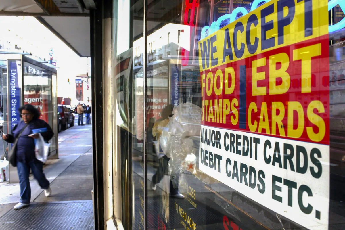 NEW YORK - OCTOBER 07: A sign in a market window advertises the acceptance of food stamps on October 7, 2010 in New York City. New York Mayor Michael Bloomberg is proposing an initiative that would prohibit New York City's 1.7 million food stamp recipients from using the stamps, a subsidy for poor residents, to buy soda or other sugary drinks. Bloomberg has stressed that obesity among the poor has reached critical levels. (Photo by Spencer Platt/Getty Images)