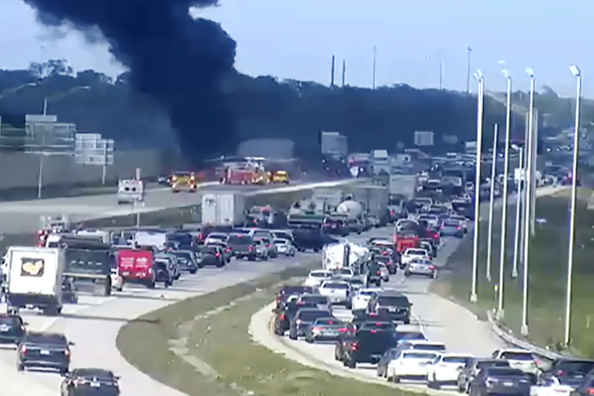 Florida Highway Patrol troopers are on the scene of a small airplane landing on southbound Interstate 75 in Naples, Fla., on Feb. 9, 2024. (Florida DOT/The News-Press via AP)
