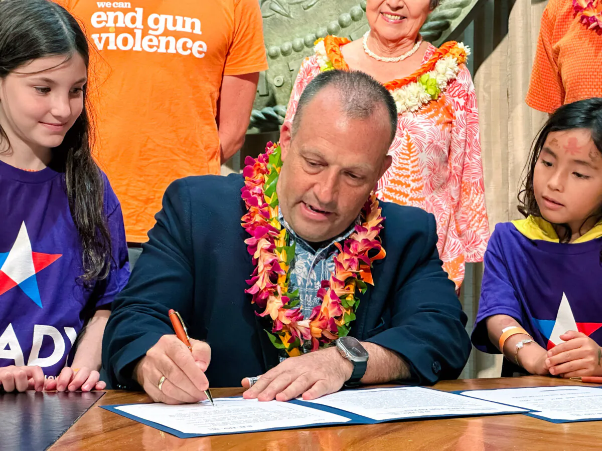 Hawaii Gov. Josh Green signs gun control legislation in Honolulu, Hawaii, on June 2, 2023. (Audrey McAvoy/AP Photo)