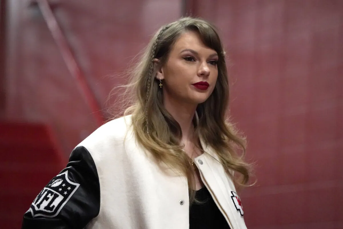 Taylor Swift enters Arrowhead Stadium before the start of an NFL football game between the Kansas City Chiefs and the Cincinnati Bengals, in Kansas City, Mo., on Dec. 31, 2023. (Ed Zurga/AP Photo)