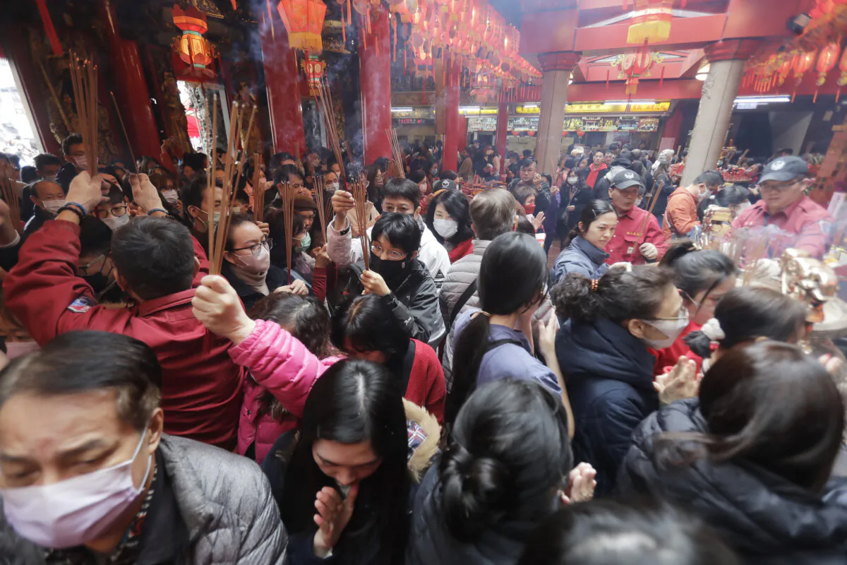 Worshippers go to pray at a temple on the first day of the Lunar New Year celebrations in Taipei, Taiwan, on Feb. 10, 2024. (Chiang Ying-ying/AP Photo)
