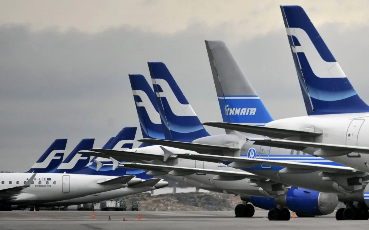 Passenger planes of the Finnish national airline company Finnair stand on the tarmac at Helsinki international airport, Helsinki on Nov. 16, 2009. (Markku Ulander/Lehtikuva via AP)