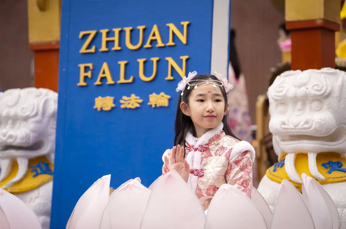 Falun Gong practitioners attend a parade celebrating the Chinese New Year, in the Flushing neighborhood of Queens, N.Y., on Feb. 10, 2024. (Samira Bouaou/The Epoch Times)