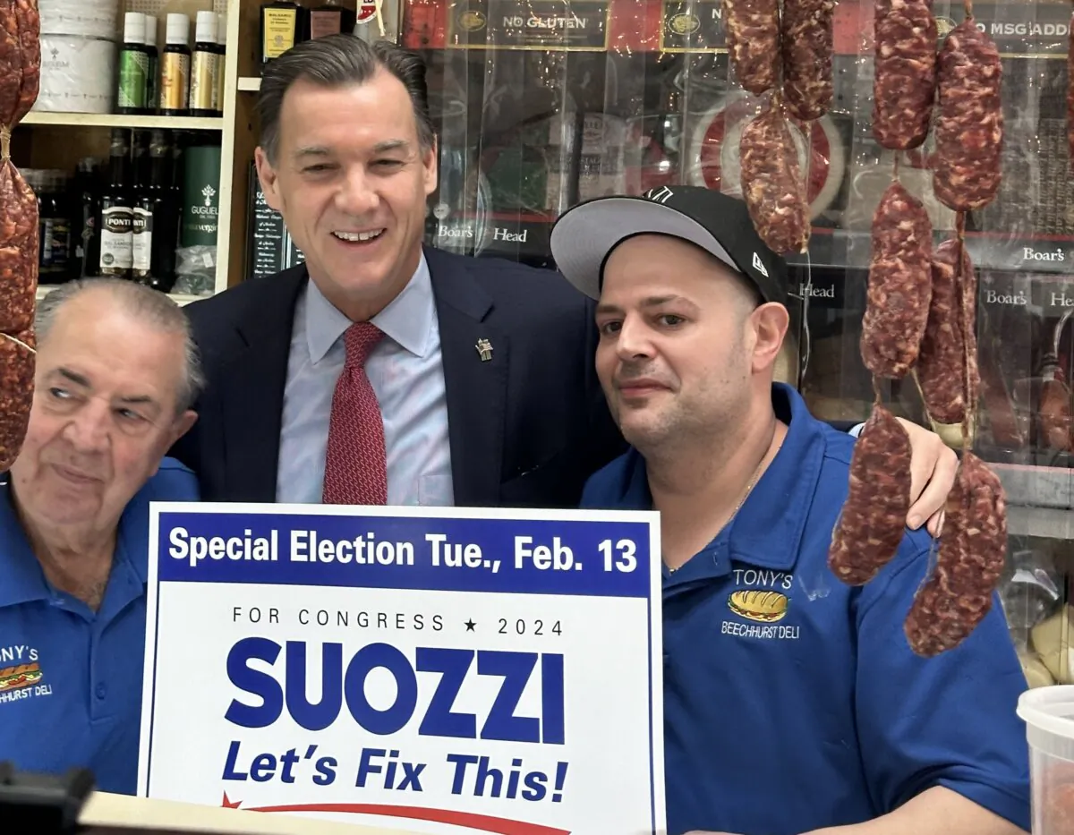 Tom Suozzi, Tony’s Beechhurst Deli owner Emilio Pulito, and a deli worker in Whitestone, Queens, on Feb. 10, 2024. (Courtesy of Juliette Fairley)