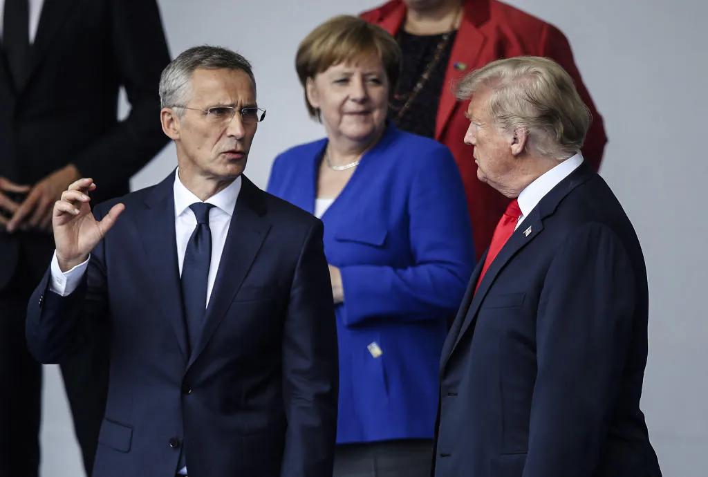 BRUSSELS, BELGIUM - JULY 11:  NATO Secretary General Jens Stoltenberg (L), German Chancellor Angela Merkel and U.S. President Donald Trump attend the opening ceremony at the 2018 NATO Summit at NATO headquarters on July 11, 2018 in Brussels, Belgium. Leaders from NATO member and partner states are meeting for a two-day summit, which is being overshadowed by strong demands by U.S. President Trump for most NATO member countries to spend more on defense.  (Photo by Sean Gallup/Getty Images)