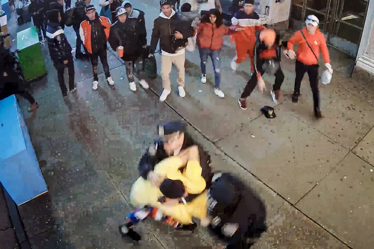 This image from video provided by the Office of the Manhattan District Attorney, shows illegal immigrants attacking New York City Police Department officers in Times Square on Jan. 27, 2024. (Manhattan District Attorney via AP)