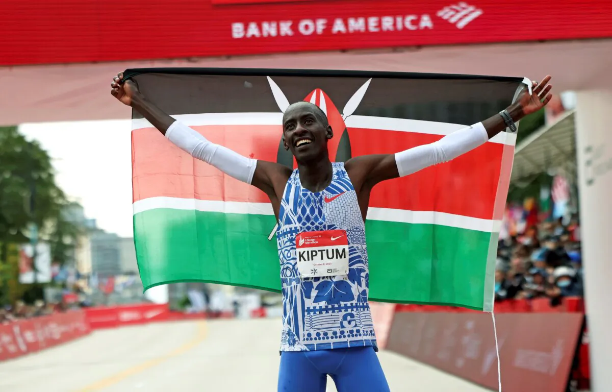 Kelvin Kiptum of Kenya celebrates his Chicago Marathon world record victory in Chicago's Grant Park on Oct. 8, 2023. (Eileen T. Meslar/Chicago Tribune via AP)