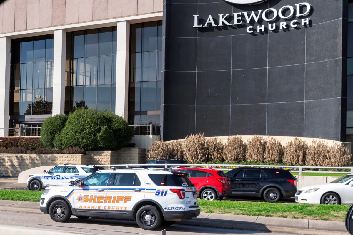 Emergency vehicles line the feeder road outside Lakewood Church during a reported active shooter event in Houston on Feb. 11, 2024. (Kirk Sides/Houston Chronicle via AP)