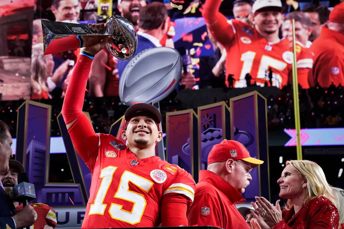 Kansas City Chiefs' quarterback #15 Patrick Mahomes celebrates with the trophy after the Chiefs won Super Bowl LVIII against the San Francisco 49ers at Allegiant Stadium in Las Vegas on Feb. 11, 2024. (Timothy A. Clary/AFP via Getty Images)