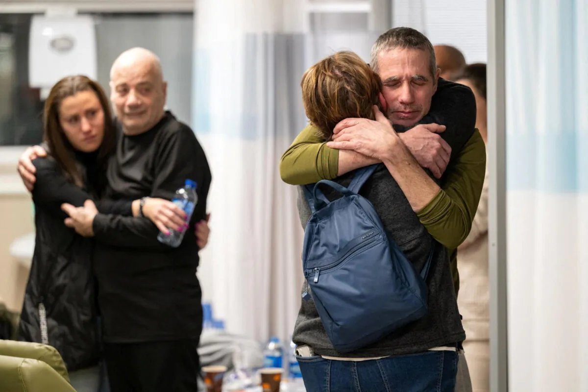 Fernando Simon Marman and Louis Hare, two Israeli hostages who, according to the Israeli military, were freed in a special forces operation in Rafah, Gaza, reunite with loved ones at the Sheba Medical Center, in Ramat Gan, Israel, on Feb. 12, 2024. (Israel Defense Forces/Handout via Reuters)