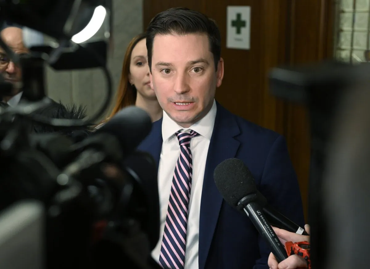 Quebec Government House Leader and Justice Minister Simon Jolin-Barrette responds to reporters' questions prior to question period at the legislature in Quebec City, on Jan. 30, 2024. (The Canadian Press/Jacques Boissinot)