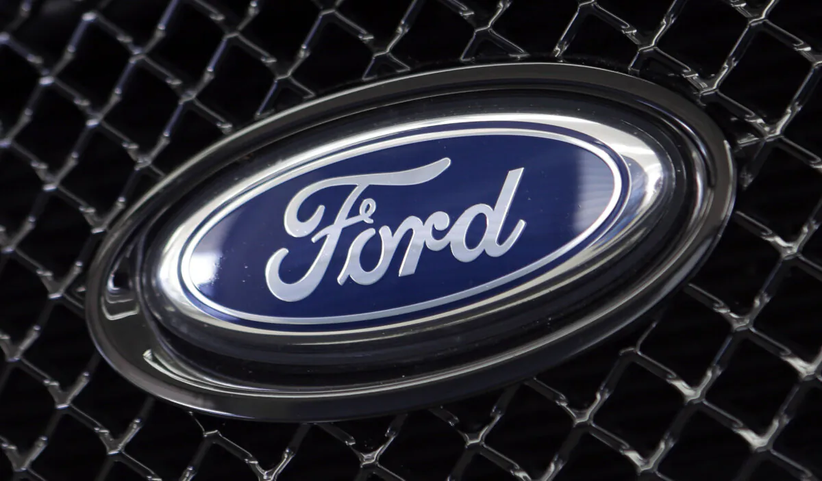 The Ford logo on a vehicle at a dealership in Hialeah, Fla., on Aug. 21, 2014. (Alan Diaz/AP Photo)